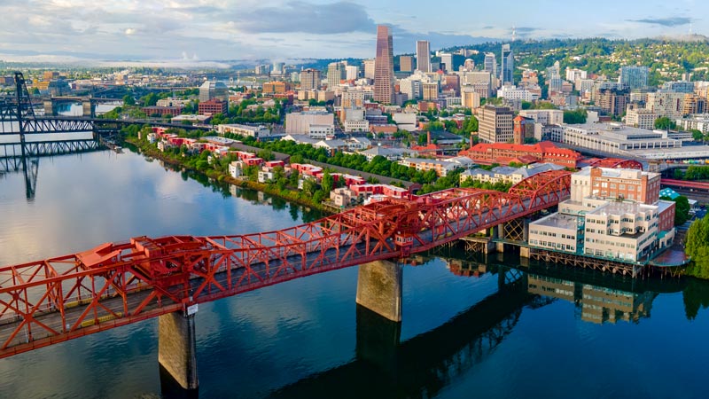 Aerial photo of Portland, Oregon, overlooking the Willamette River, bridges and buildings.